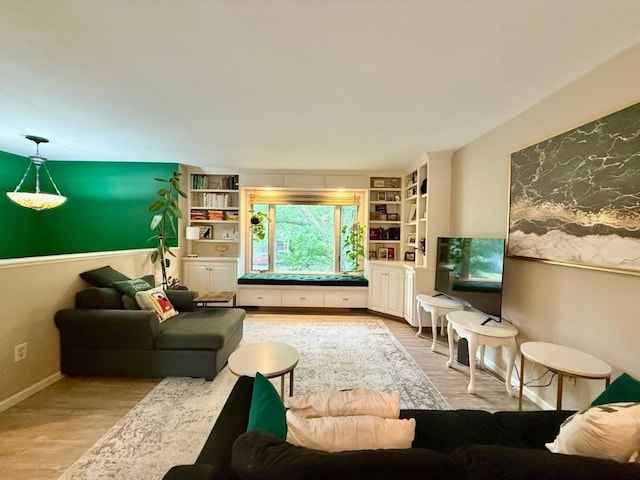 104 Oberlin St, Iowa City, IA 52245 - living room with wood finished floors and built in shelves