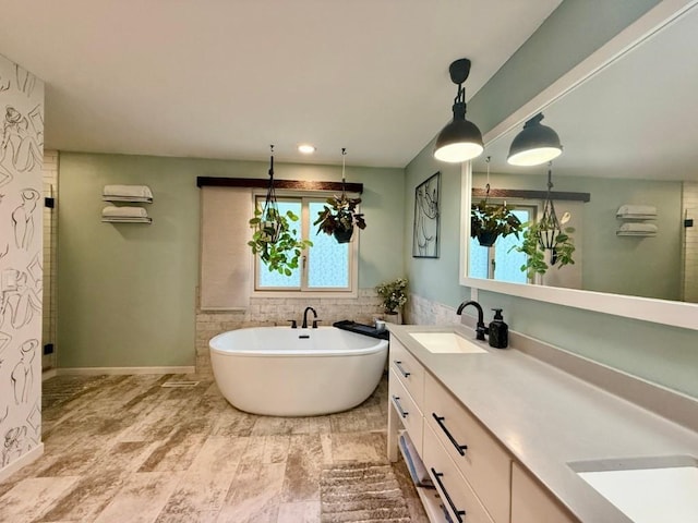 104 Oberlin St, Iowa City, IA 52245 - bathroom featuring a freestanding bath and double vanity