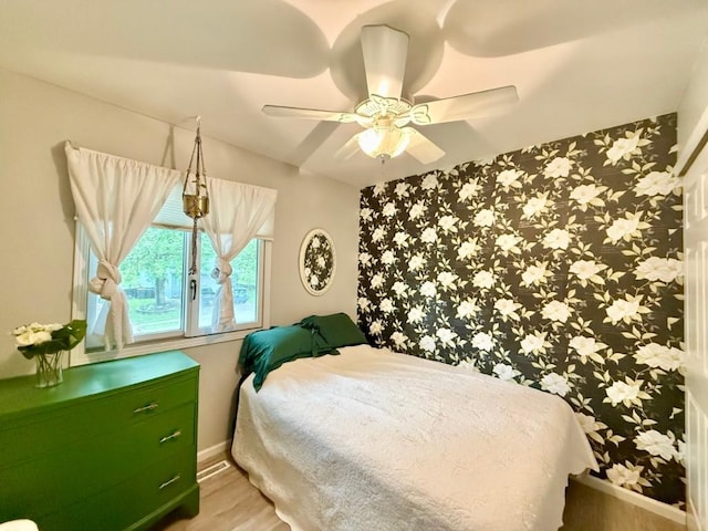 104 Oberlin St, Iowa City, IA 52245 - bedroom with ceiling fan and light wood-type flooring