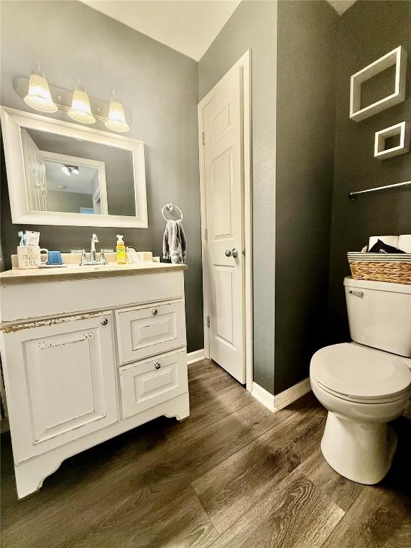 507 Maplewood Dr, Center Point, IA 52213 - bathroom with wood finished floors and vanity