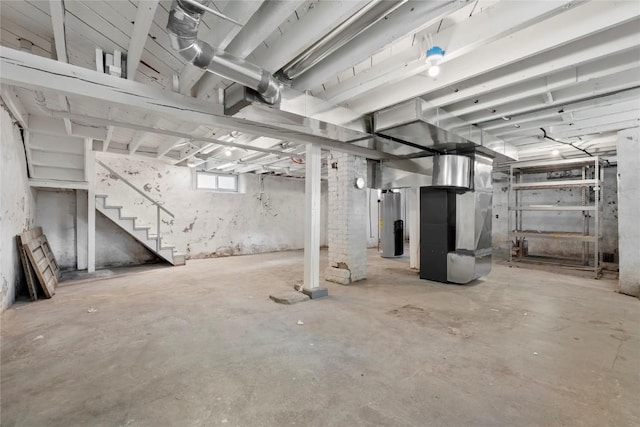 1356 Hinkley Ave NW, Cedar Rapids, IA 52405 - basement featuring stairs, gas water heater, and heating unit