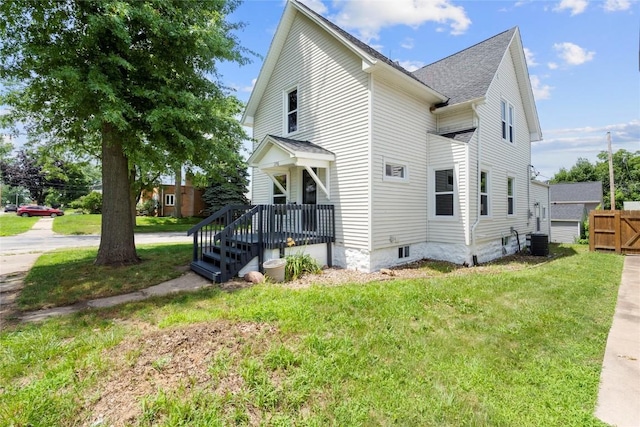 1356 Hinkley Ave NW, Cedar Rapids, IA 52405 - view of side of home featuring a cooling unit and roof with shingles