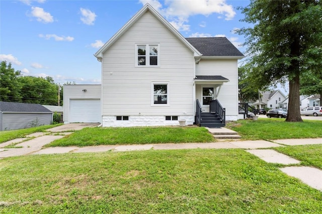 1356 Hinkley Ave NW, Cedar Rapids, IA 52405 - view of front facade featuring a garage, a front lawn, and concrete driveway