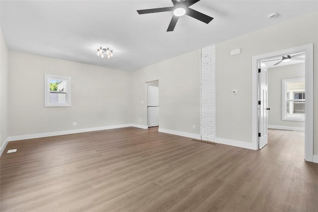 1356 Hinkley Ave NW, Cedar Rapids, IA 52405 - spare room with ceiling fan, wood finished floors, and a smoke detector