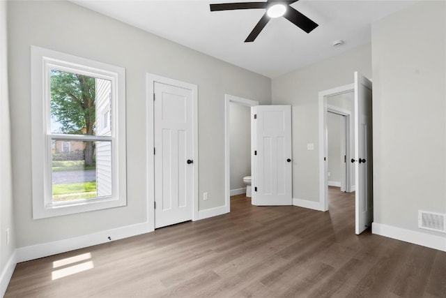 1356 Hinkley Ave NW, Cedar Rapids, IA 52405 - unfurnished bedroom with wood finished floors and a ceiling fan
