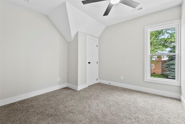 1356 Hinkley Ave NW, Cedar Rapids, IA 52405 - empty room with carpet floors, a ceiling fan, and vaulted ceiling