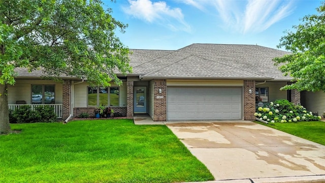 1459 Buckingham Ln, Iowa City, IA 52245 - view of front facade with an attached garage, brick siding, and a front yard