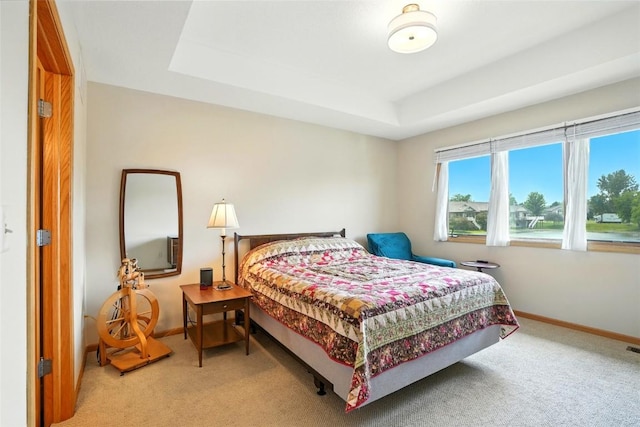 1459 Buckingham Ln, Iowa City, IA 52245 - carpeted bedroom featuring baseboards and a raised ceiling