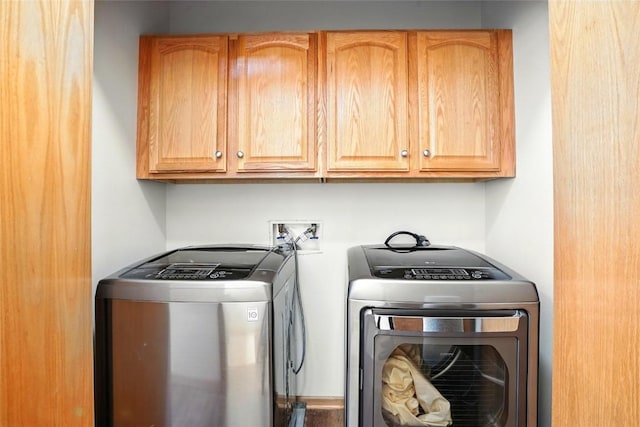 1459 Buckingham Ln, Iowa City, IA 52245 - laundry area with washing machine and dryer and cabinet space