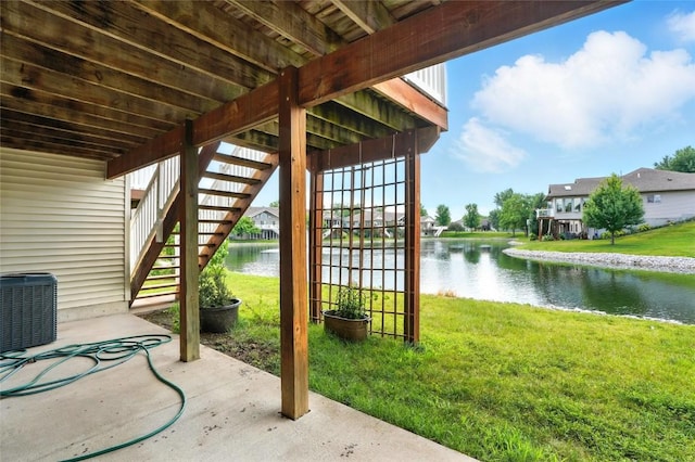 1459 Buckingham Ln, Iowa City, IA 52245 - view of patio with stairway and a water view