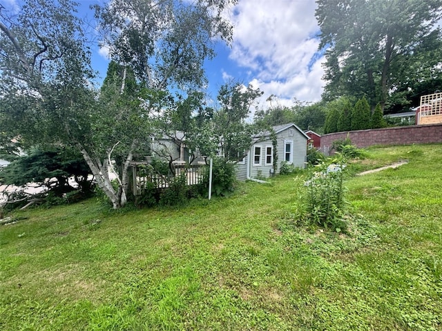 1640 11th St NW, Cedar Rapids, IA 52405 - view of green lawn featuring a wooden deck