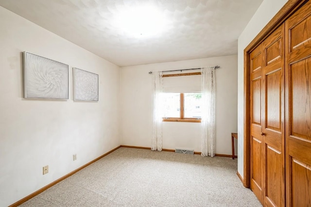 1595 17th Ave, Marion, IA 52302 - unfurnished bedroom with light carpet and a closet