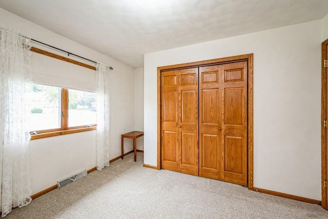 1595 17th Ave, Marion, IA 52302 - bedroom featuring carpet flooring and a closet