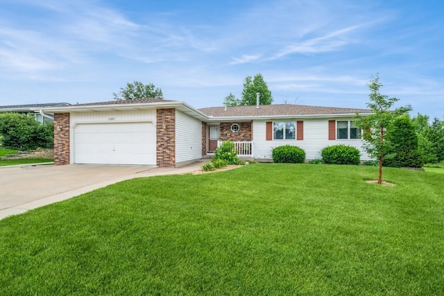 1595 17th Ave, Marion, IA 52302 - single story home featuring concrete driveway, an attached garage, and a front yard