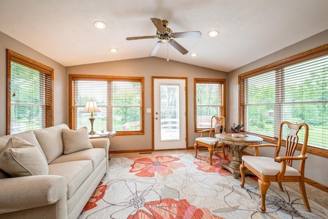 1595 17th Ave, Marion, IA 52302 - living area with lofted ceiling, healthy amount of natural light, ceiling fan, recessed lighting, and light carpet