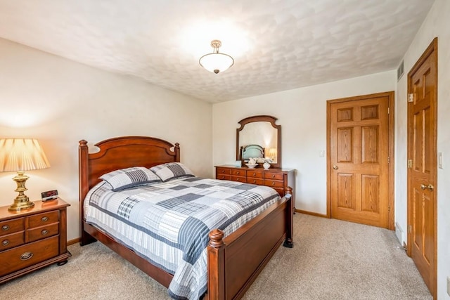 1595 17th Ave, Marion, IA 52302 - bedroom with light colored carpet and a textured ceiling