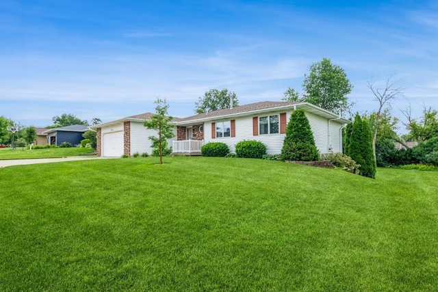 1595 17th Ave, Marion, IA 52302 - ranch-style house featuring concrete driveway, a front yard, and an attached garage