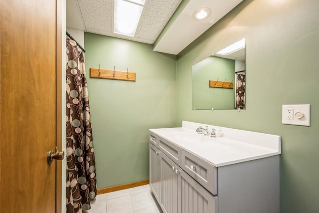 1595 17th Ave, Marion, IA 52302 - full bathroom with vanity, tile patterned floors, and a drop ceiling