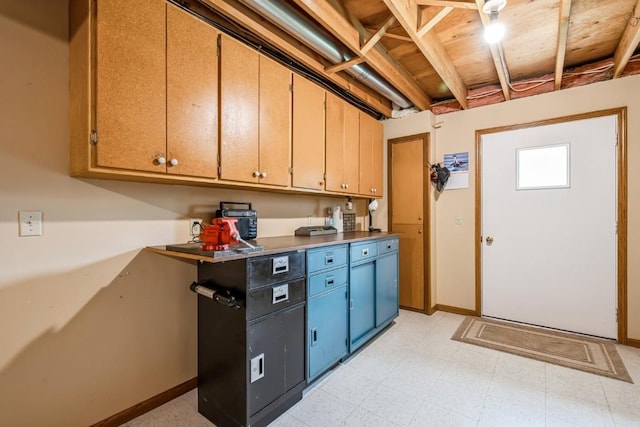 1595 17th Ave, Marion, IA 52302 - kitchen with light floors and blue cabinetry