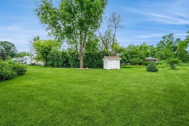 1595 17th Ave, Marion, IA 52302 - view of green lawn featuring a storage unit
