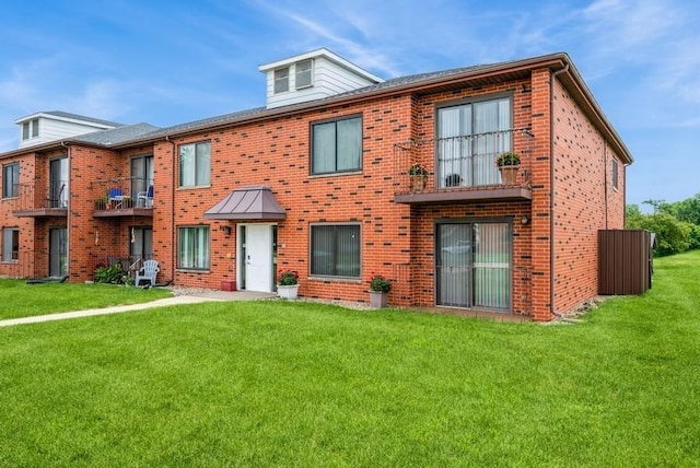 809 Kerry Ln SE Unit 66, Cedar Rapids, IA 52403 - view of front facade featuring a front lawn and brick siding