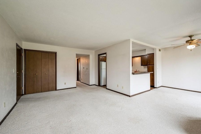 809 Kerry Ln SE Unit 66, Cedar Rapids, IA 52403 - unfurnished bedroom with light colored carpet and freestanding refrigerator