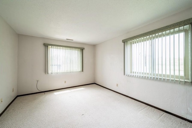 809 Kerry Ln SE Unit 66, Cedar Rapids, IA 52403 - spare room with carpet and baseboards