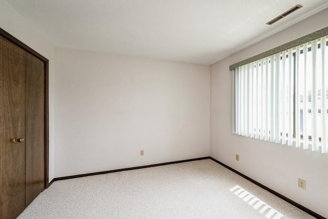 809 Kerry Ln SE Unit 66, Cedar Rapids, IA 52403 - unfurnished bedroom featuring carpet floors