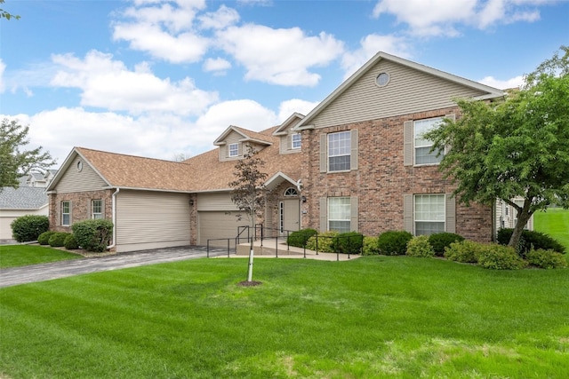 4710 Westchester Dr NE Unit C, Cedar Rapids, IA 52402 - view of front of property with asphalt driveway, a front lawn, an attached garage, and brick siding