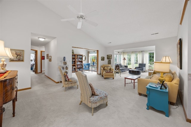 4710 Westchester Dr NE Unit C, Cedar Rapids, IA 52402 - living room with light carpet, high vaulted ceiling, and a ceiling fan