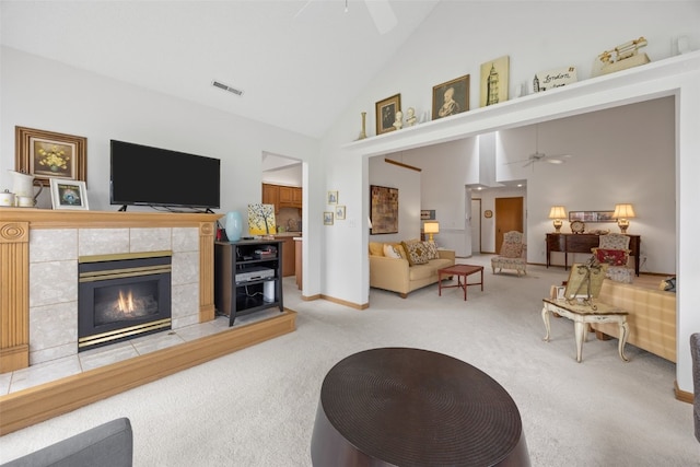 4710 Westchester Dr NE Unit C, Cedar Rapids, IA 52402 - living area with a ceiling fan, light carpet, high vaulted ceiling, and a tile fireplace