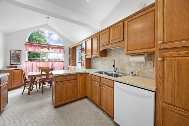4710 Westchester Dr NE Unit C, Cedar Rapids, IA 52402 - kitchen with dishwasher, vaulted ceiling, light countertops, light carpet, and brown cabinetry