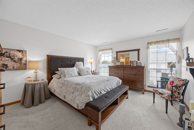 4710 Westchester Dr NE Unit C, Cedar Rapids, IA 52402 - bedroom featuring carpet flooring and a textured ceiling