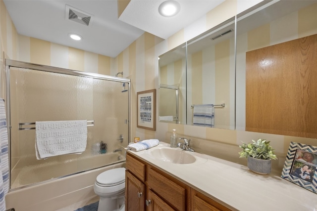 4710 Westchester Dr NE Unit C, Cedar Rapids, IA 52402 - full bath with wallpapered walls, vanity, and shower / bath combination with glass door