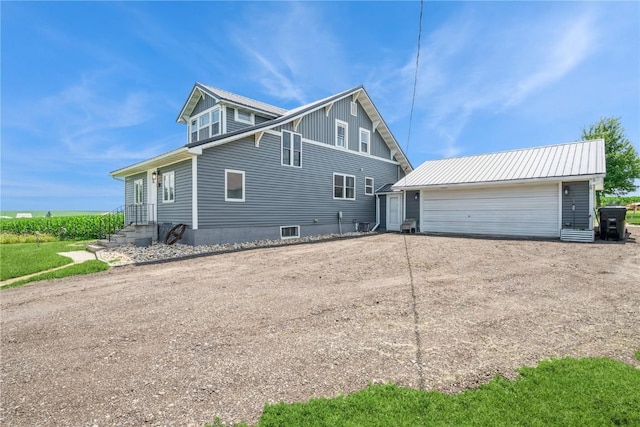 111 Maple St, Luzerne, IA 52257 - view of side of property featuring an outbuilding and driveway