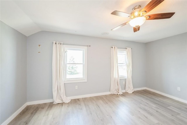 111 Maple St, Luzerne, IA 52257 - spare room featuring plenty of natural light, wood finished floors, ceiling fan, and vaulted ceiling
