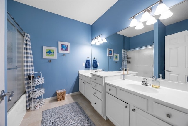 422 Rock Ridge Rd NW, Cedar Rapids, IA 52405 - bathroom featuring double vanity, shower / bath combination with curtain, and tile patterned flooring