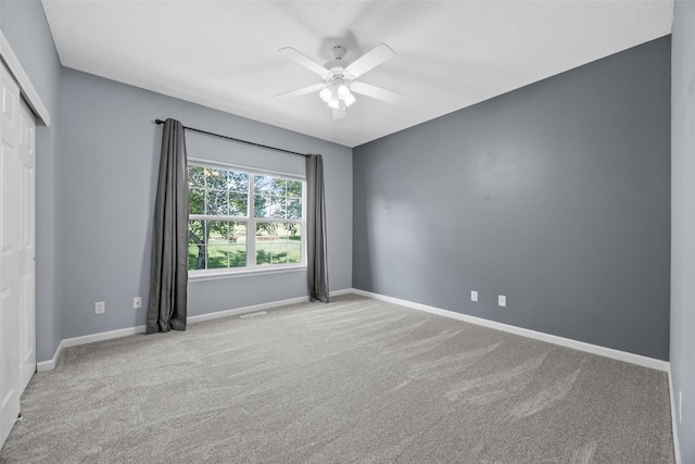 422 Rock Ridge Rd NW, Cedar Rapids, IA 52405 - carpeted spare room with a ceiling fan and baseboards