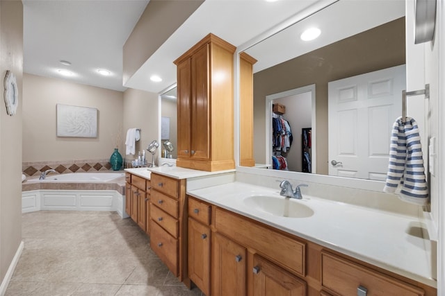 422 Rock Ridge Rd NW, Cedar Rapids, IA 52405 - full bathroom with double vanity, tile patterned floors, a bath, recessed lighting, and a walk in closet