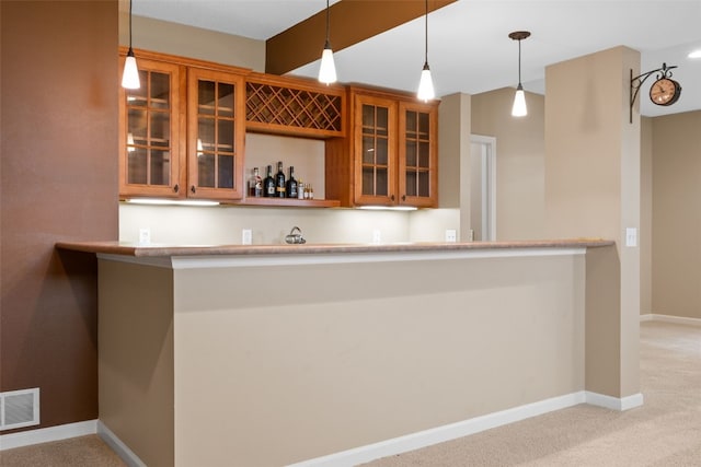 422 Rock Ridge Rd NW, Cedar Rapids, IA 52405 - indoor bar featuring carpet and hanging light fixtures