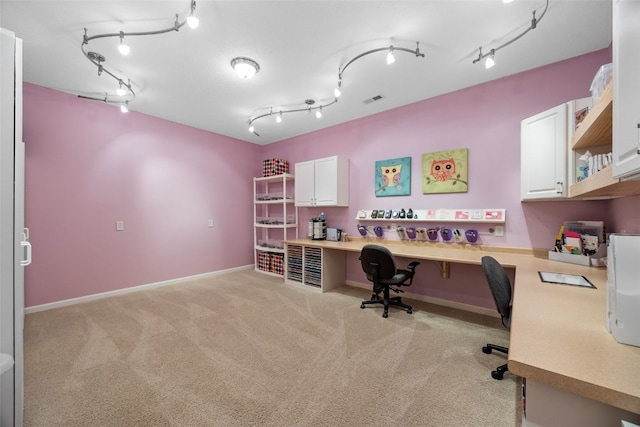 422 Rock Ridge Rd NW, Cedar Rapids, IA 52405 - office area featuring light carpet, built in desk, and track lighting