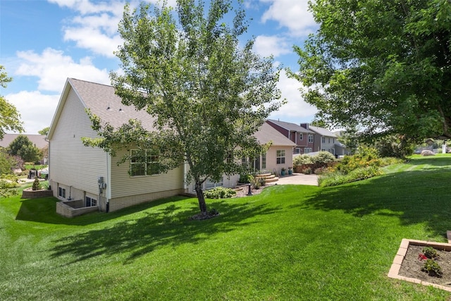 422 Rock Ridge Rd NW, Cedar Rapids, IA 52405 - back of house featuring a yard and a patio area