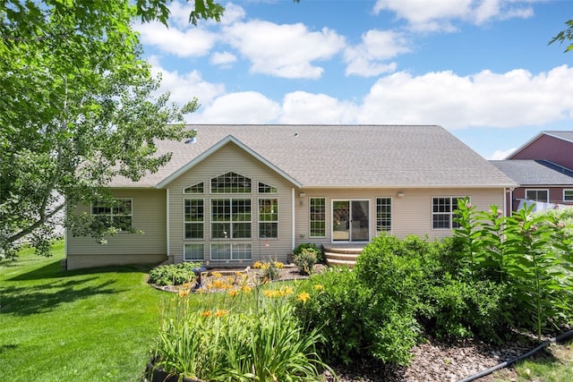422 Rock Ridge Rd NW, Cedar Rapids, IA 52405 - back of property with a yard and roof with shingles