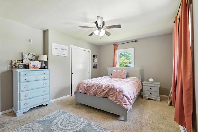 2113 Ridgewood Ave, Muscatine, IA 52761 - bedroom with light colored carpet and ceiling fan