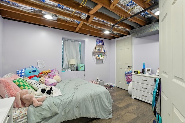 2113 Ridgewood Ave, Muscatine, IA 52761 - bedroom featuring dark wood-style flooring and baseboards