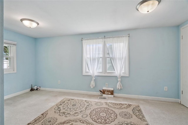 100 W Short St, Solon, IA 52333 - carpeted empty room with baseboards