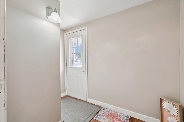 100 W Short St, Solon, IA 52333 - doorway featuring baseboards and wood finished floors