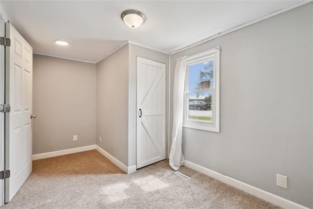 100 W Short St, Solon, IA 52333 - unfurnished bedroom featuring light carpet and a closet