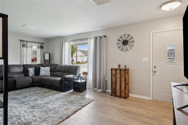 75 Jefferson Ave SW, Swisher, IA 52238 - living area featuring light wood-style flooring and baseboards