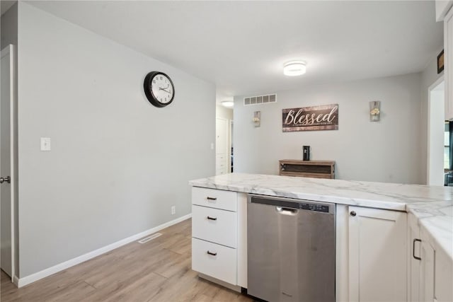 75 Jefferson Ave SW, Swisher, IA 52238 - kitchen featuring stainless steel dishwasher, light wood-type flooring, white cabinets, and light stone countertops